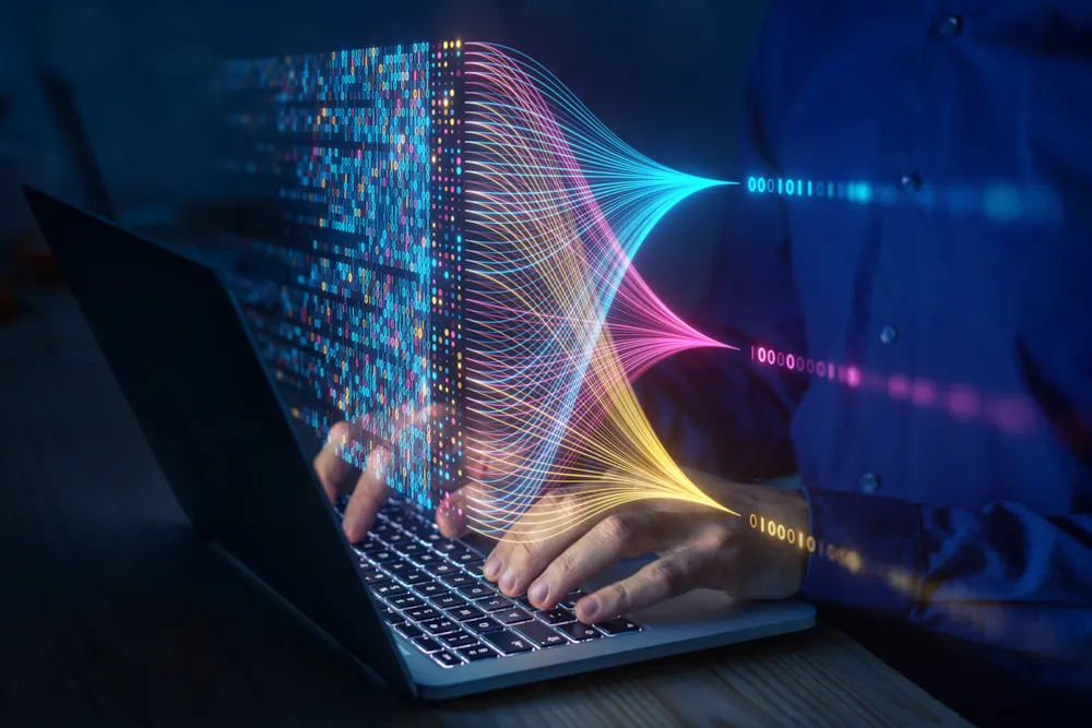 <p>A pair of hands working on a laptop in a dark environment and computing, analysing and visualizing complex data sets.</p>